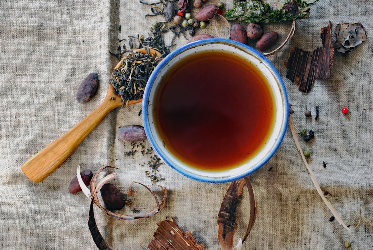 Warm cup of tea held near window light